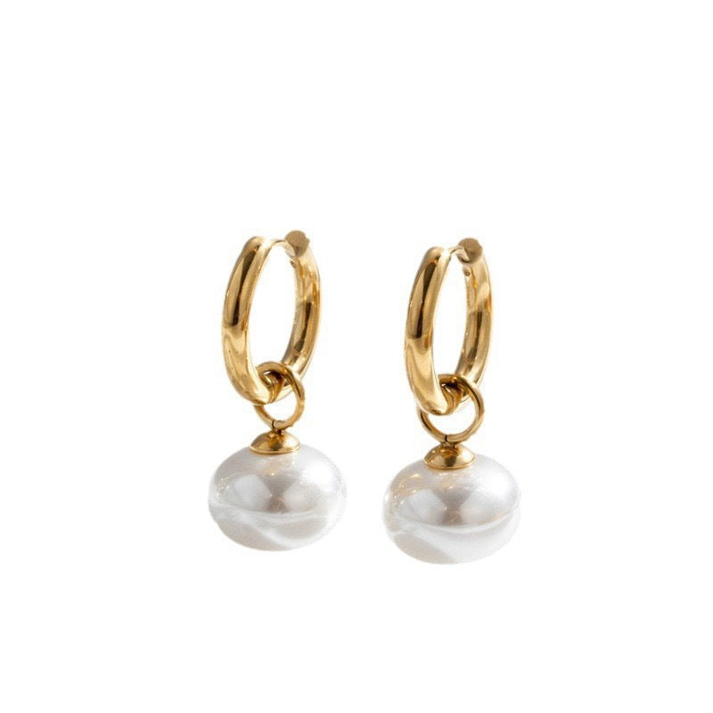 Stainless steel earrings with flattened round pearl-like studs